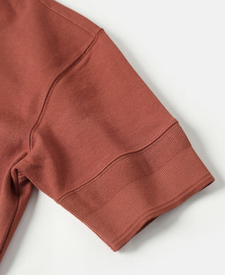 Brick red henley T-shirt sleeve hem with ribbed cuff and stitched seam detail