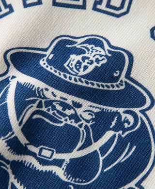 White raglan sweatshirt close-up of blue mascot hat and sailor graphic