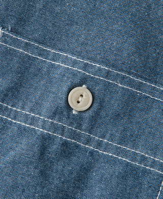 Chambray shirt button detail with double-stitching lines on placket