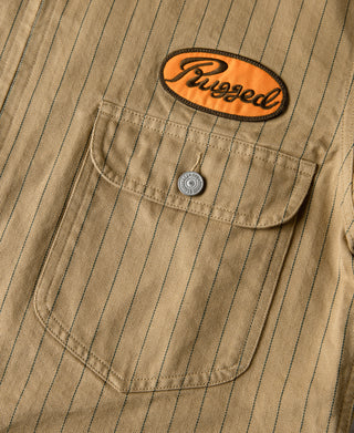 Khaki striped chore coat chest pocket with orange Pugged patch and snap