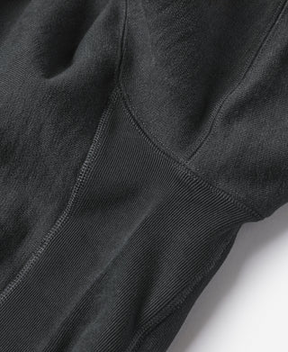 Black hoodie fabric and topstitching near kangaroo pocket