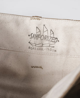 Khaki interior fabric label with embroidered emblem