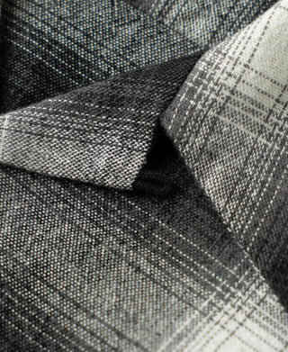 Close-up of ombre check sports shirt placket and folded fabric texture