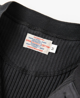 Black ribbed henley interior neck label at the back of the collar