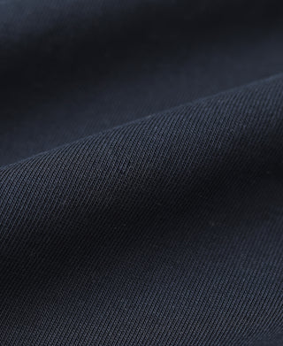 Navy henley shirt knit fabric texture on the long sleeve.