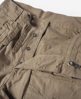 Khaki bermuda shorts with side tabs, button closures, and pocket hardware