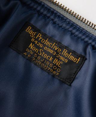 Navy helmet bag interior label with printed protective text