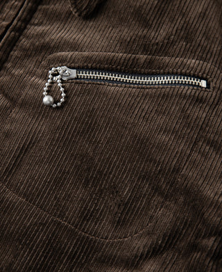 Brown corduroy cossack jacket chest pocket with metal zipper pull and beaded detail