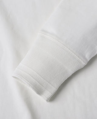 White ribbed long-sleeve henley cuff detail