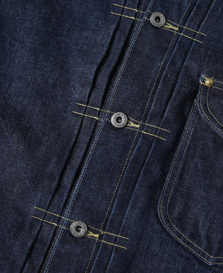 Indigo denim jacket front close-up with button placket and flap pocket
