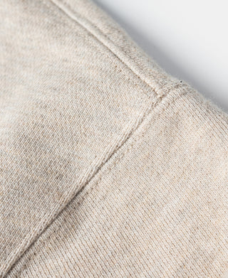 Oatmeal fleece sweatshirt sleeve with reinforced side stitch and knit texture