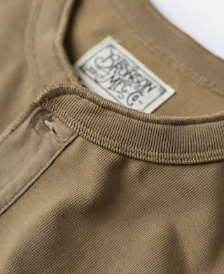 Khaki henley with brand label patch at neckline and ribbed trim