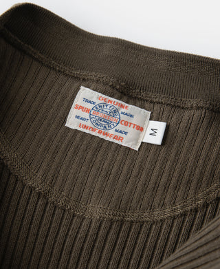 Olive-brown ribbed henley neckline with fabric tag and short button placket