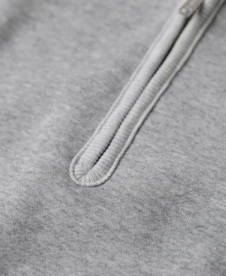 Gray fleece half-zip placket and front hem seam detail