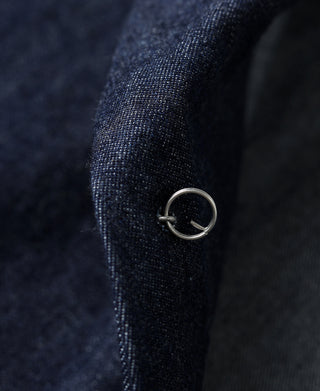 Indigo denim jacket cuff with ring-style metal detail