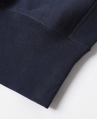 Navy ribbed sweatshirt cuff and hem seam detail