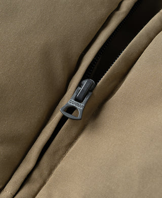 Khaki quilted padded vest with black zipper and metal pull tab