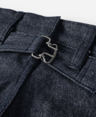 Dark denim front with metal suspender-style clips on the waistband