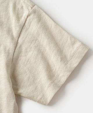 Cream T-shirt sleeve hem and cuff stitching close-up