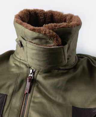 Olive high-collar flight jacket with brown shearling lining and front zipper