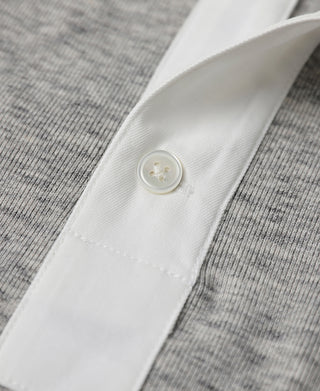White button placket detail on gray heather side-closing henley shirt