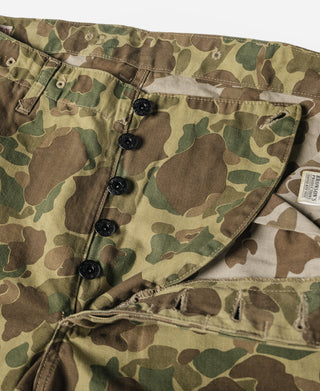 Camouflage cargo pants front with five black buttons and large flap pocket