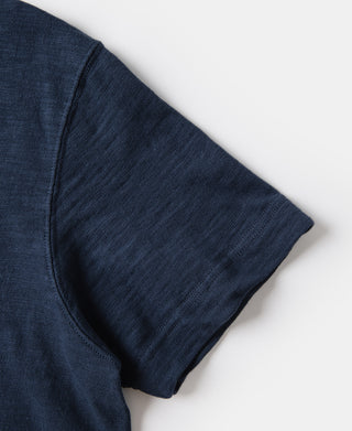 Indigo t-shirt sleeve edge close-up with seam stitching