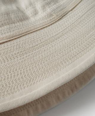 Off-white hat brim edge with stitched trim detail