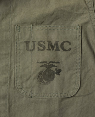 Olive jacket chest pocket with USMC logo patch