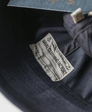 Navy Dixie Cup hat interior label reading 'Nava' 'Clothing and Fabric'