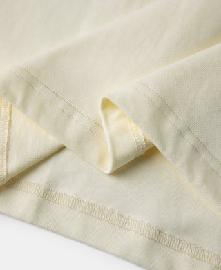 Cream henley T-shirt shoulder yoke and sleeve opening seam detail