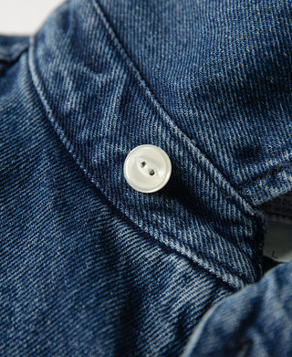 Stonewashed indigo denim work jacket button placket detail