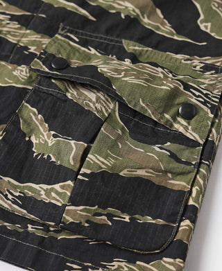 Camo jacket chest pocket flaps with dark snap buttons and stitched seams.