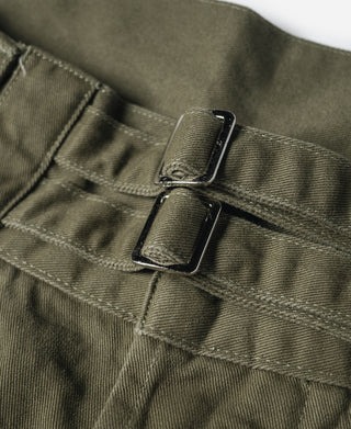 Olive Bermuda pants waistband with metal buckle-style closure