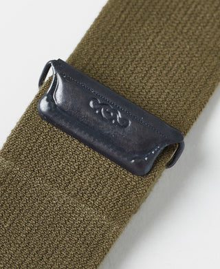 Olive strap end with dark leather cover and embossed marking