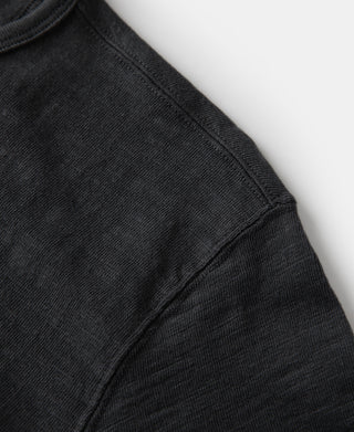 Loopwheel tubular henley T-shirt in black, side seam and sleeve hem detail