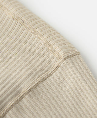 Ribbed henley T-shirt sleeve cuff and knit texture, light apricot