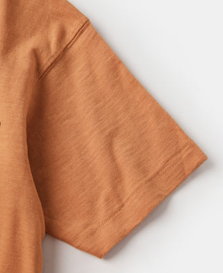 Orange short-sleeve t-shirt in slub cotton, side angle.