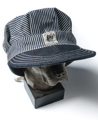 Railroad engineer cap with striped crown, dark front brim, and front label patch