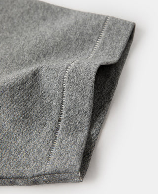 Gray heather t-shirt sleeve cuff hem with visible stitching close-up