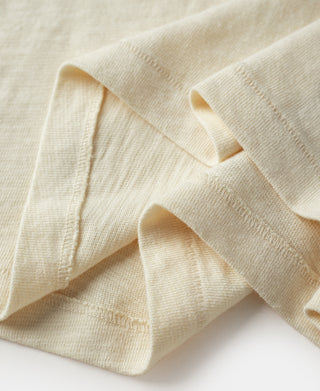 Cream T-shirt sleeve and cuff with ribbed trim close-up