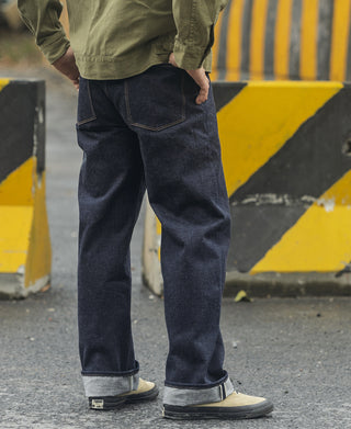 Indigo denim jeans with side pockets and visible cuff