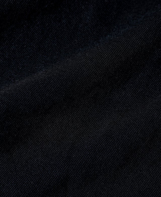 Black cotton tubular T-shirt fabric texture, tight knit with subtle surface grain