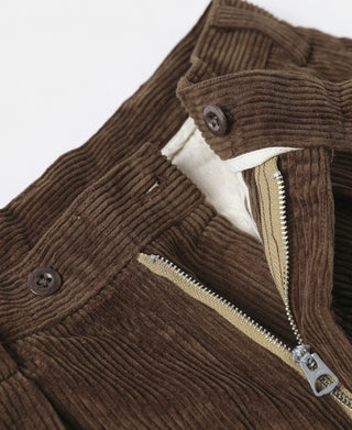 Brown corduroy trousers with front zipper fly and metal pull