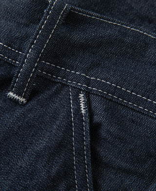 Indigo denim painter pants with topstitched seams and pocket edge detail
