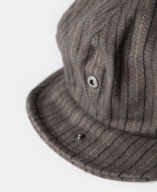 Dark gray striped newsboy cap side with metal grommet and two buttons