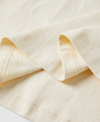Off-white cotton T-shirt crew neckline and short sleeve opening