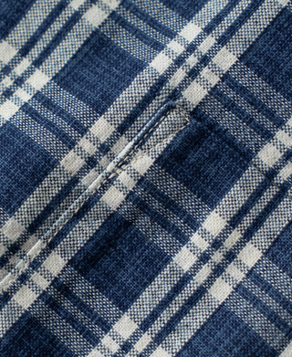 Blue and white plaid woven fabric texture with tight grid pattern