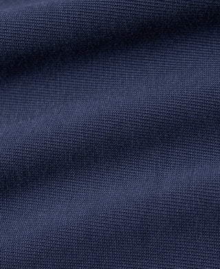 Navy T-shirt fabric texture close-up with fine knit pattern