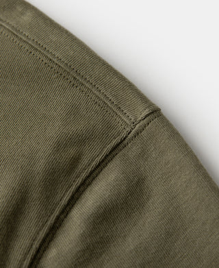 Olive henley t-shirt shoulder seam with ribbed knit cuff on short sleeve